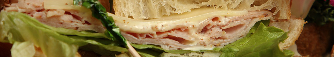 Eating Sandwich at Agrusa's Super Sandwiches restaurant in Escondido, CA.